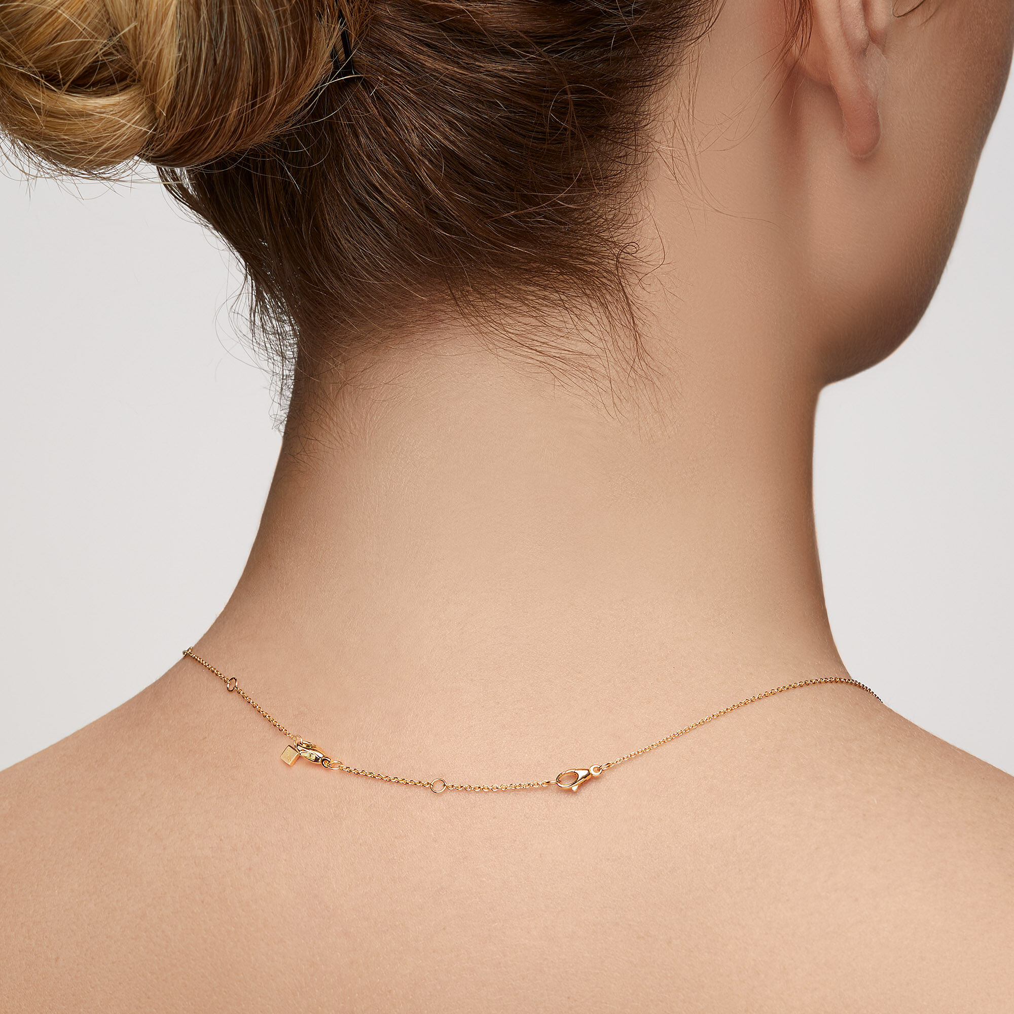 Gold necklace extension chain top